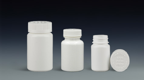 Three common caps for plastic pill bottles